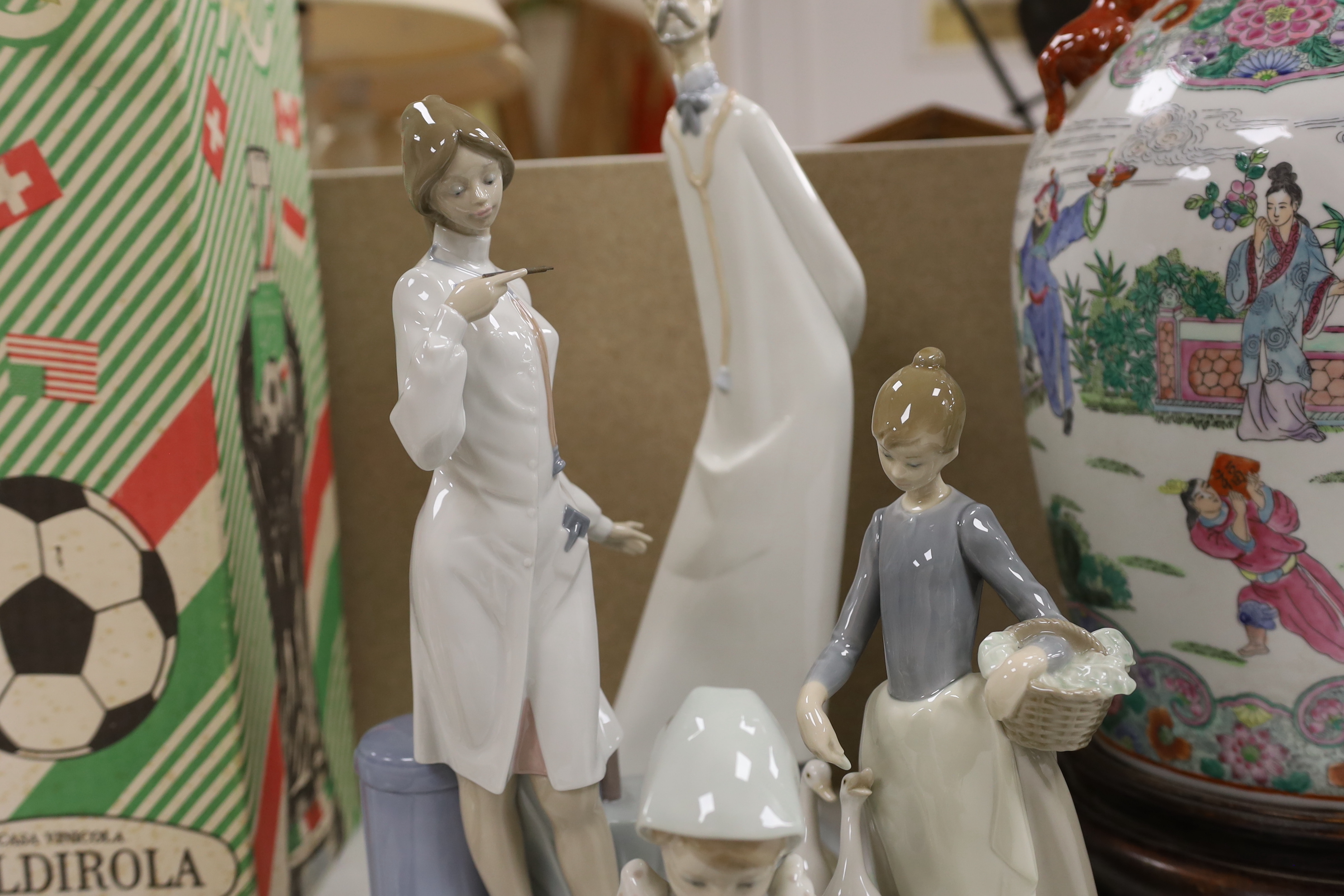 A group of four LLadro figures, tallest 41cm